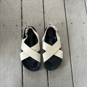 Cream and black leather sandals